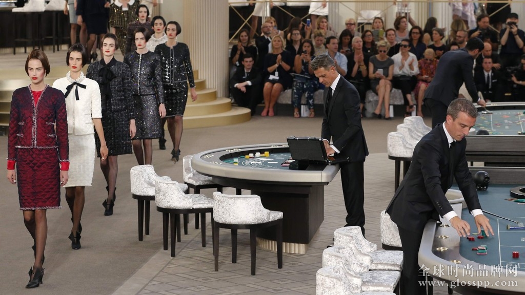 Models present creations by German designer Karl Lagerfeld as part of his Haute Couture Fall Winter 2015/2016 fashion show for French fashion house Chanel at the Grand Palais in Paris